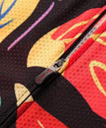 Close-up of colorful abstract pattern on fabric with zipper detail