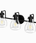 Black Three Light Vanity Light Fixture With Clear Glass Shades For Bathroom Over Mirror
