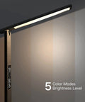Led Desk Lamp With Wireless Charger And USB Port in dimmable mode with digital display showing clock and temperature.