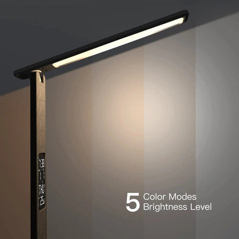 Led Desk Lamp With Wireless Charger And USB Port in dimmable mode with digital display showing clock and temperature.