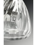 Close-up of Anjoux Collection 3-Light Clear Water Glass Luxe Bath Vanity Light shade, showcasing intricate glass design.