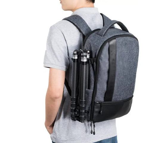 Beast Pro Camera Backpack With Large Capacity For Two Bodies, Four Lenses, Tripod And Laptop on a person's back, ergonomic straps visible