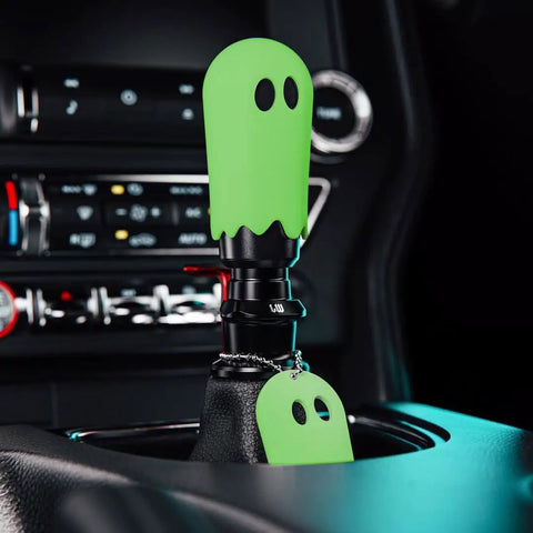 Flat Out Smooth Shifting Universal Gear Knob Featuring Glowing Phantom Etching And Contoured Machined Aluminum Handle For Easy Night Cruising Plus Three No Sweat Mount Adapters in green ghost design.