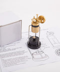 Retro Three Legged Oscillating Steam Engine Model Kit with manual and box, showcasing brass and black components