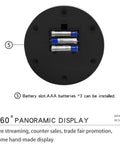 Battery slot for the sleek motorized rotating display stand, holding three AAA batteries for powered operation.