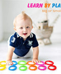Baby playing with Link To Go Baby Rings Toy Kit For Stroller Car Seat Crib Clip On Play Mat Early Education Set
