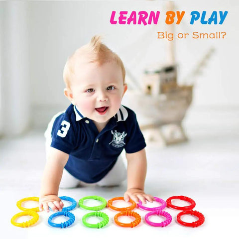 Baby playing with Link To Go Baby Rings Toy Kit For Stroller Car Seat Crib Clip On Play Mat Early Education Set
