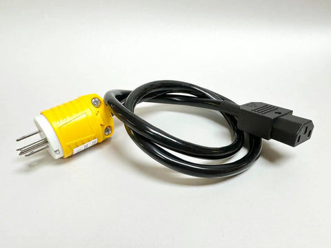 Black power cable with a yellow plug end on a white surface