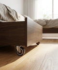 Smooth Operator Vertical Track Roller For Heavy Duty Sliding Barn Doors With Rock Solid Anti Sag Bracket And Quiet Double Bearing Rubber Bottom Wheels Upgrade Kit mounted on wooden furniture.
