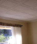 Glue Up Foam Ceiling Tiles For Popcorn Ceilings 48 Pack 128 Sq Ft Per Case Plain White Lightweight Styrofoam Panels installed in a room