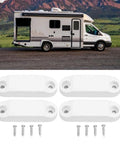 RV Baggage Door Holder Latch Keep Doors Open 4 Pack, white plastic with screws, in front of camper and mountains