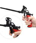 Heavy Duty Foam Gun For Caulking And Sealing, Professional PU Expanding Foam Sprayer With Precision Trigger held in hand