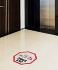 Stop That Tugger Now With These Heavy Duty Red Anti Slip Floor Decals Featuring Tough Round Vinyl Stickers For Warehouses And Factories To Boost Safety And Guide Forklifts Perfectly On Any Surface placed on a floor near an elevator.
