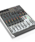 4 Channel USB Mixer With Phantom Powered XENYX Mic Preamps, Four Studio Grade Compressors on a flat surface