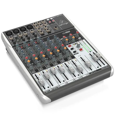 4 Channel USB Mixer With Phantom Powered XENYX Mic Preamps, Four Studio Grade Compressors on a flat surface