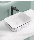 USZWBY Vessel Sinks Nordic Household Wash Basin Modern Above Counter Single Art Ceramic Bathroom Balcony Bathroom Bowl Sink on marble countertop with black faucet.