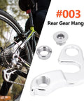Rear Derailleur Hanger For Mountain Bike Aluminum Alloy Dropout Adapter Tail Hook shown next to a bicycle wheel
