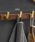 Solid Heavy Duty Wall Mounted Coat Rack Kit With Five Slick Hooks For Entryway Bathroom Organization No Sweat Storage Setup For Jackets Hats Keys Everyday Use on textured wall with gray towel.