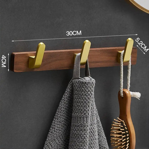 Solid Heavy Duty Wall Mounted Coat Rack Kit With Five Slick Hooks For Entryway Bathroom Organization No Sweat Storage Setup For Jackets Hats Keys Everyday Use on textured wall with gray towel.