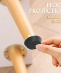 Kick Those Nasty Cabinet And Desk Shakes Flat With Heavy Adjustable Furniture Levelers And Table Feet Screw Direct Install For Chairs Tables And Bookshelves 100 Pack, black non-slip furniture leveler on wooden table leg.