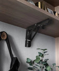 These Badass Heavy Duty Folding Shelf Brackets Bring Serious Strength As A 10 Inch Floating Triangle Wall Mount Hinge Setup built into a wood shelf.
