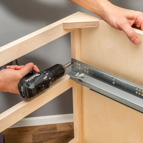 Installing Top Shelf 21 Inch Undermount Drawer Slides with drill, showing smooth glide and soft close mechanism.
