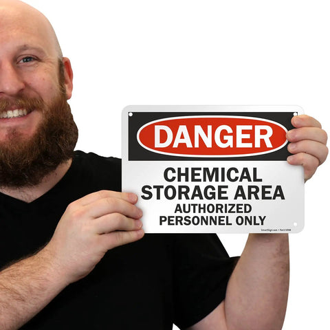 Man holding Heavy Duty Aluminum Hazard Warning Plate 7 X 10 Inches Built Like A Tank For Chemical Storage Areas And Authorized Personnel Only Rust Free Fade Resistant Print.