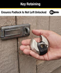 Hand holding 70mm disc padlock with tough cut octagonal boron carbide shackle for indoor and outdoor security, ideal for storage units.