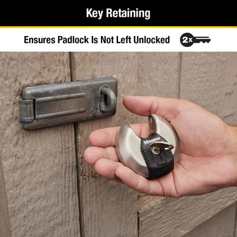 Hand holding 70mm disc padlock with tough cut octagonal boron carbide shackle for indoor and outdoor security, ideal for storage units.