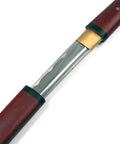 Close-up of Handmade Japanese Shirasaya Samurai Katana Sword with full tang razor sharp carbon steel blade and dark wood handle.