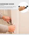 Hand holding 2 Pack Barn Door Handles Beefy Metal Sliding Door Pull Handles for Cabinet with Comfortable Grip, black hardware