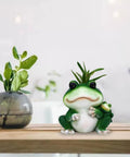 Frogs Planter Silicone Molds For Epoxy Resin And Concrete Crafts displaying frog planter on table with plants in background.