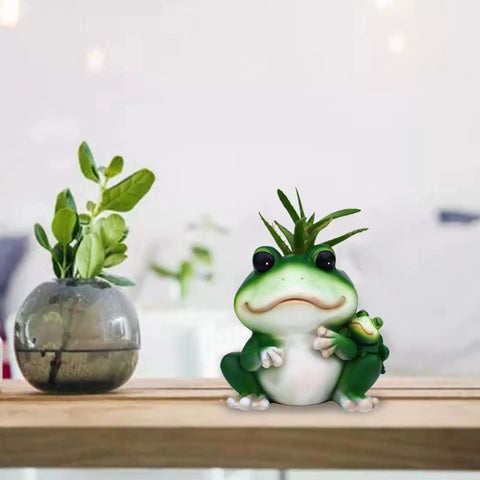 Frogs Planter Silicone Molds For Epoxy Resin And Concrete Crafts displaying frog planter on table with plants in background.