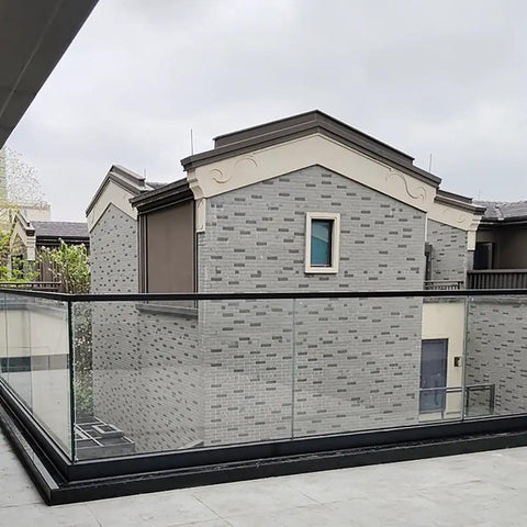 Heavy Duty Glass Railing System For Deck And Balcony Featuring Rock Solid Spigot Clamps installed around a balcony area.