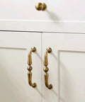Antique Bronze Cabinet Handle And Drawer Pull Set With 5 Inch Center To Center Spacing on white doors