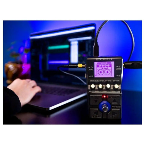 Person using MS 80IR Plus MultiStomp Amp And Cabinet Modeler Pedal with laptop, USB connected, in a studio setting.
