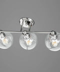Three Light Coastal Vanity Light With Clear Glass Shades In Polished Nickel Finish For A Modern Beachy Bathroom Glow And Vibe