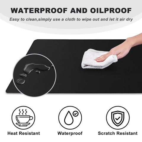 Person wiping Beast Mode Massive Gaming Mouse Pad Desk Mat 31.5x15.7 Inches with Stitched Edges Non Slip Waterproof Rubber Base.