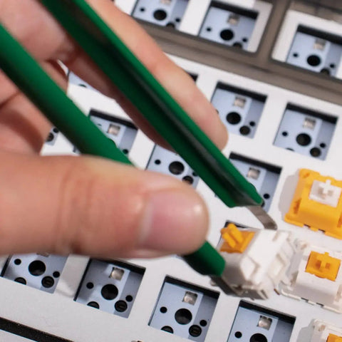 Close-up of hand using tweezers on Two Layer Switch Lubrication Station For Mechanical Keyboards With Quick 33 Switch Lube Capability