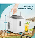 Portable Ice Maker Cranking Out Twenty Six Pounds Daily Produces Nine Bullet Cubes In Six Flat Minutes Boasts Self Cleaning Tray And Slim Countertop Profile For Zero Hassle Hosting At Home Or Backyard Parties on outdoor table.