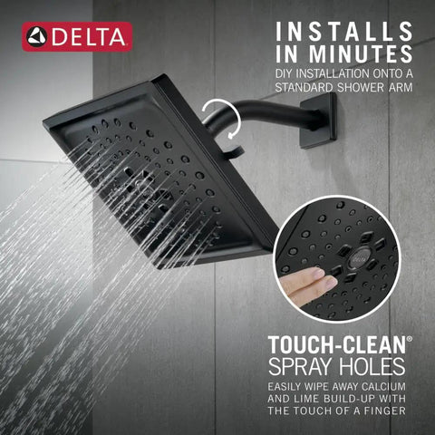 Three-Spray H2Okinetic Shower Head Matte Black 52684-BL with spray holes and water flow on a tiled wall.