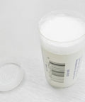 Open 2 oz container of Jewelers Cutting Lubricant Wax For Saw Blades Burs And Wire Drawing Hi Tech Lubrication for smooth cuts.