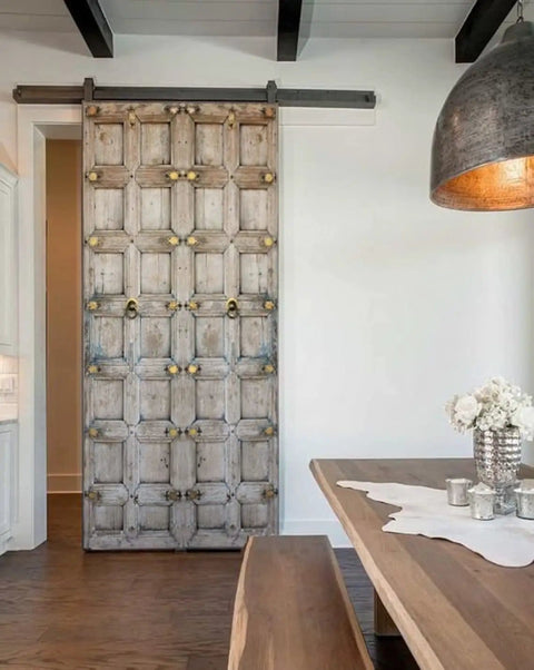 Vintage Indian Door Rustic Barn Style Front And Interior Exterior Wooden Door With Custom Size Option Single Or Double Old Look Sliding Or Hinged No Glass No Hardware showing intricate design in modern dining room