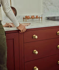 Solid Brass Cabinet Knob Set Of 6 Unlacquered Brass Round Ball Drawer Pulls For Kitchen Cabinets Vanity Dresser One And One Eighth Inch Diameter Living Patina Finish on red drawers in kitchen.