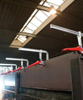 Heavy Duty 20 Inch Lever Clamp With Quick Grab Ratchet Jaw Dead Nuts Cold Drawn Steel Frame securing metal beams in workshop.