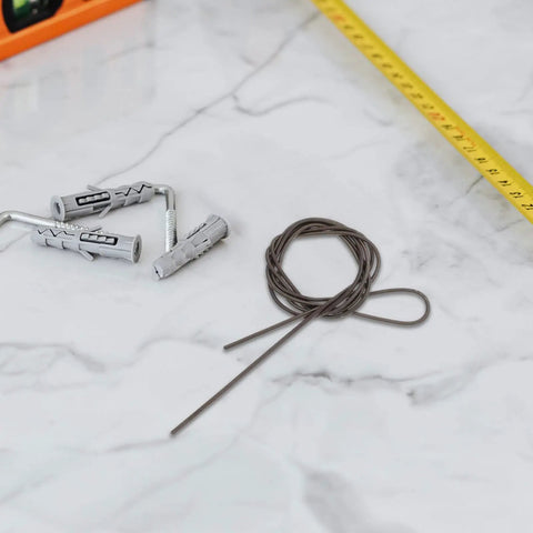 Premium Manganese Steel Mechanical Extension Spring Kit With Dual Hooks Offers Serious Traction, Adjustable Firm Hold And Durable Industrial Performance For Any Tough Job You Need To Get Done Fast. Extension spring kit with gray wall plugs and metal wire on tile