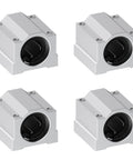 Four white aluminum SCS8UU linear bearing blocks with 8mm bore