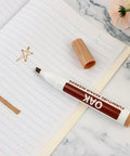 Oak color wood repair marker on paper, cap off, showing ink color; Wood Repair Markers Touch Up Kit For Stains And Scratches On Wooden Floors