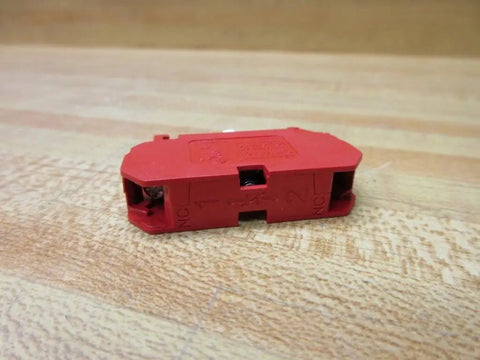 Straight Up Heavy Duty 10 Amp 22 Mm 600 Vac Contact Block Featuring Normally Closed Contacts And Vibrant Red Housing side view on wood background