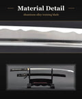Close-up of unsharpened aluminum Iaido katana training sword with 28 inch blade, showing fullered groove for audible swing.